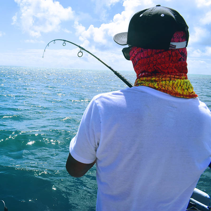 Close-up of a man fishing in the ocean