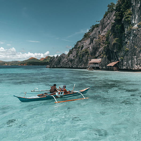 Fishermen on a boat in the Philippines