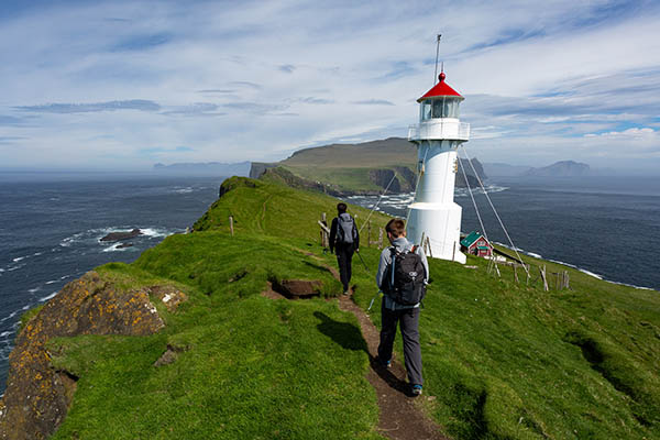 Hiking to the lighthouse on Mykines island in Faroe Islands