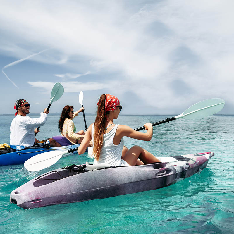 Friends kayaking in tropical waters