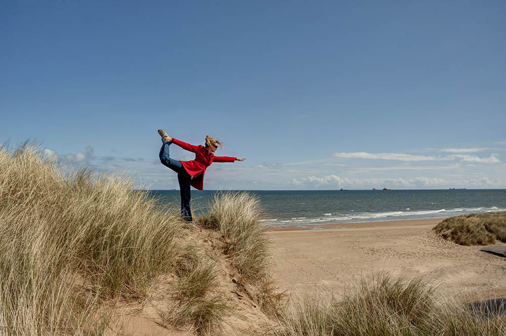 Natarajasana at the beach in Cornwall, Great Britain