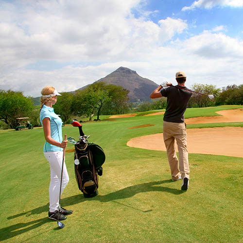 Man and woman playing golf on Mauritius