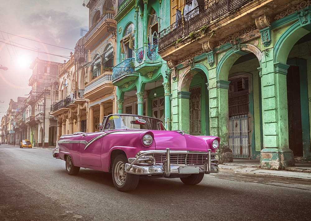 Vintage classic pink American convertible car in old town of Havana Cuba