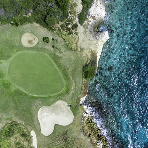 Aerial View of Caribbean Sea and Green - Golf Course