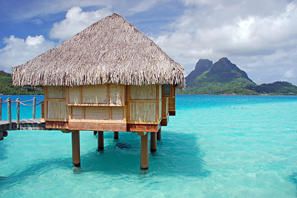 Overwater bungalow and view of Mount Otemanu, Bora Bora, French Polynesia