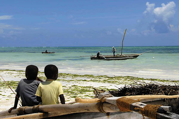 Two young boys on a beach in the Bijagos islands, Guinea Bissau