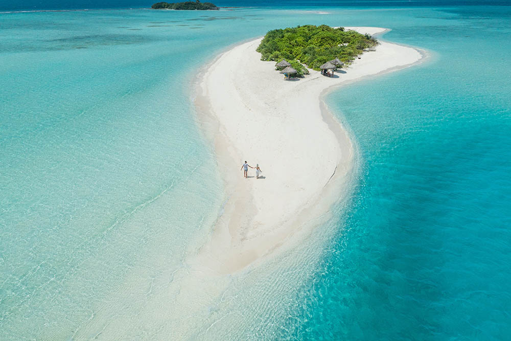 Aerial view of a wedding couple on a deserted island in the Maldives