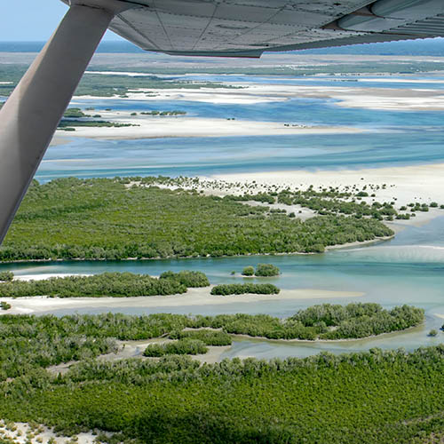 Flying over the islands of Mozambique in a light aircraft