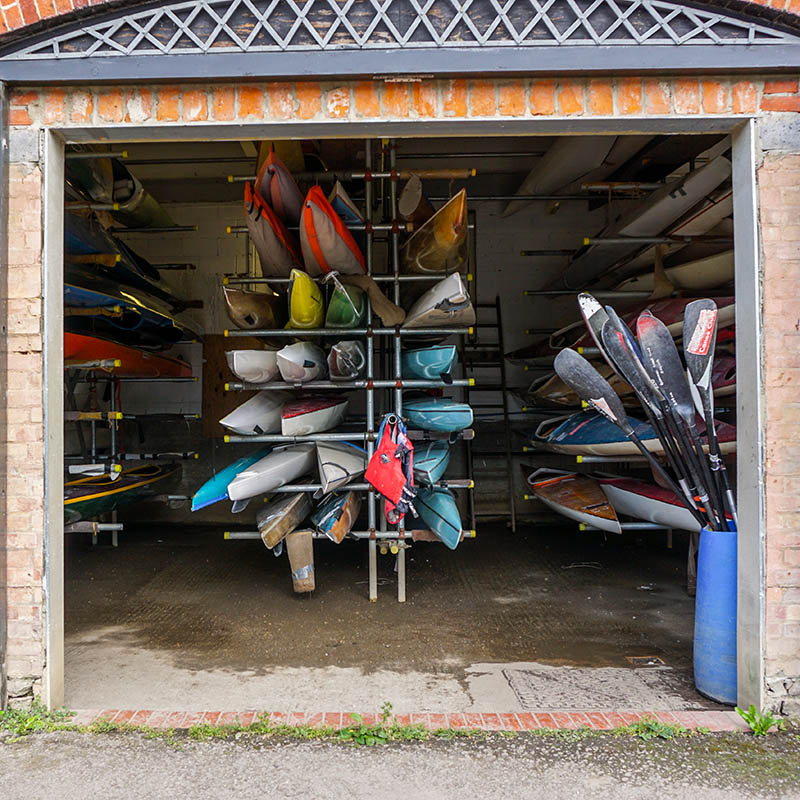 Colourful canoes in a boatshed in Richmond, London