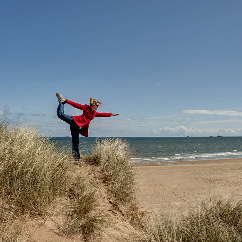 Natarajasana at the beach in Cornwall, Great Britain