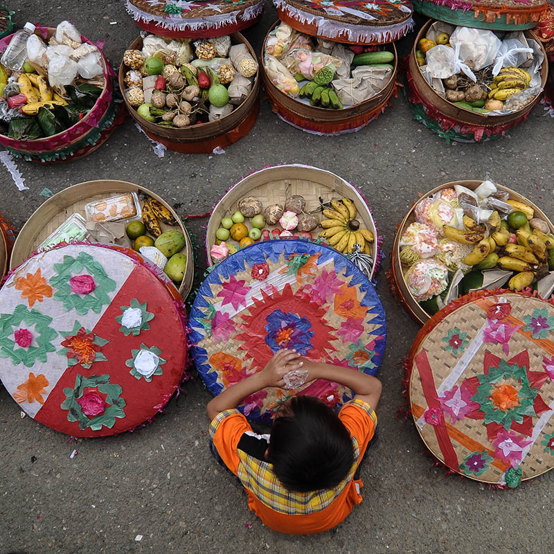 Tenongan a tradition in Java Indonesia where people share foods, carrying with a box called tenong