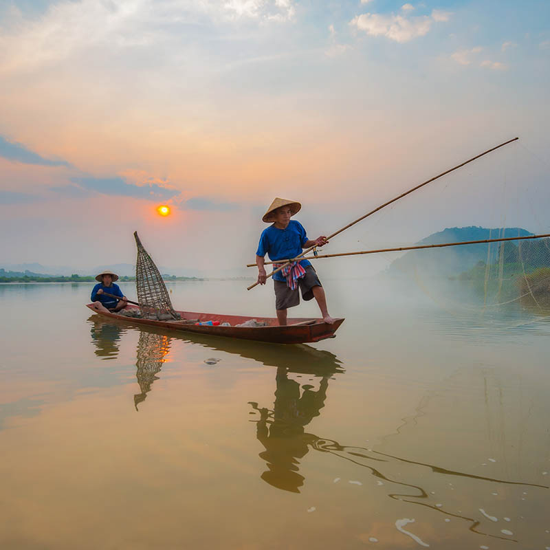 Traditional fishermen on the Mekong River