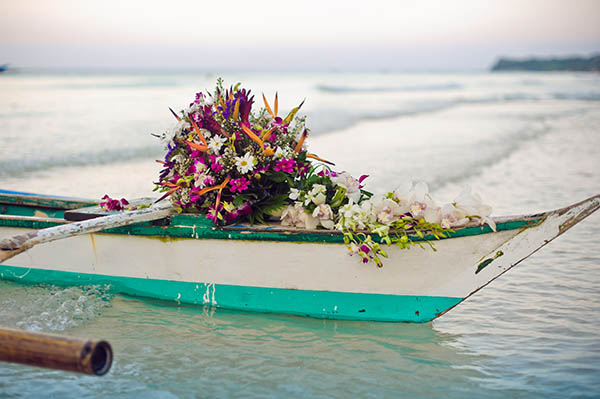 Philippine boat and a bouquet of flowers. Wedding in the tropics concept