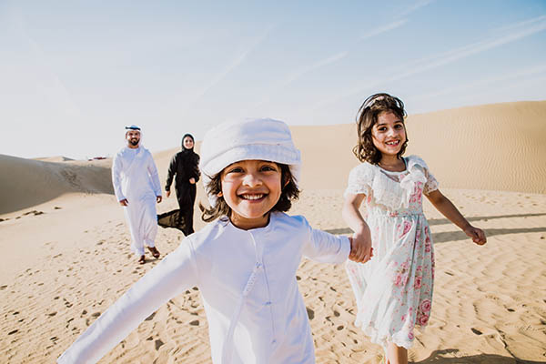 Happy Arab family in the desert