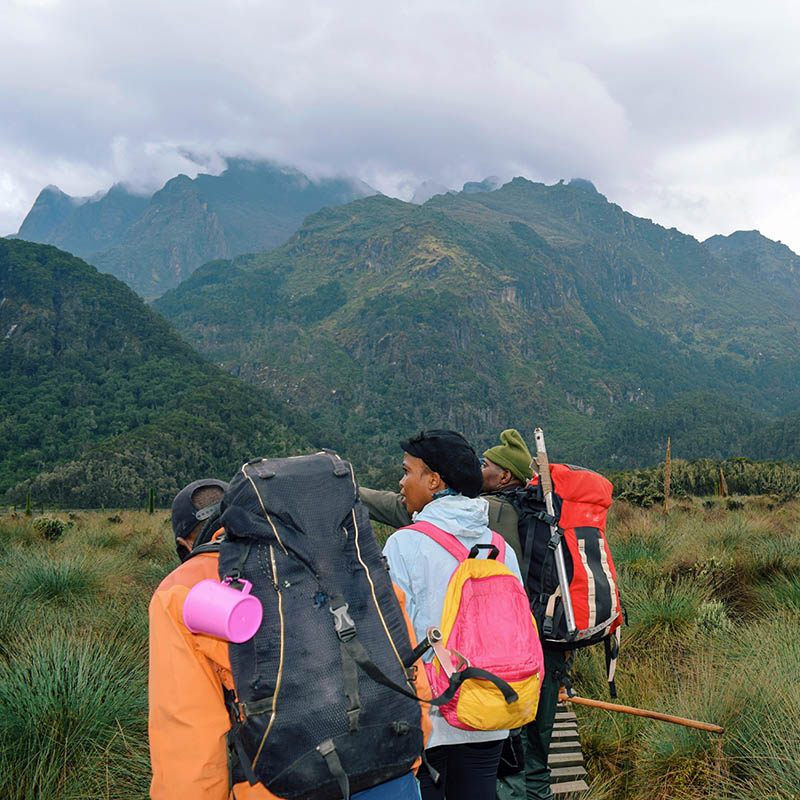 A group of hikers against a mountain background at Rwenzori Mountains