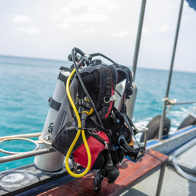 Scuba Diving Tanks Regulator and BCD Equipment on a dive boat