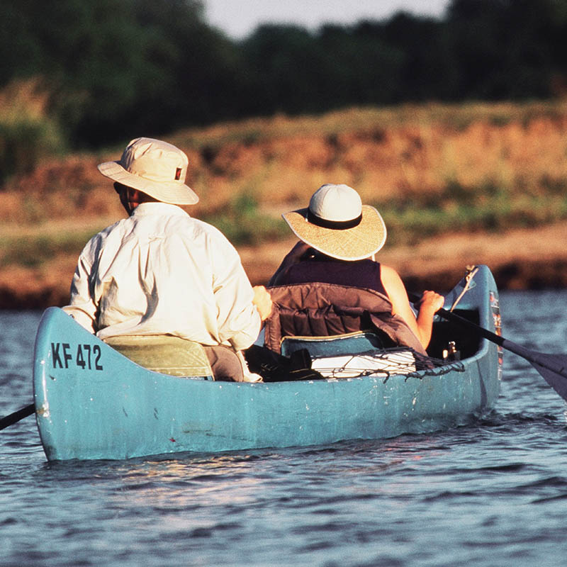 Couple canoeing at Mana Pools, Zimbabwe