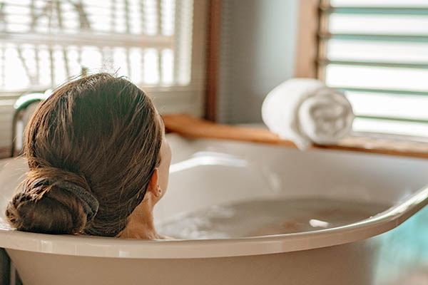 Woman relaxing in a luxury bath