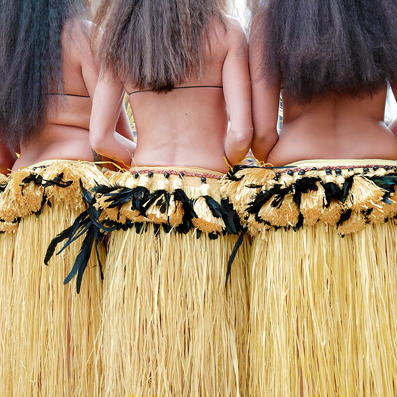 Rear view of several dancers wearing the traditional folk costume