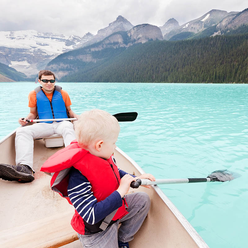 Father & son kayaking in Canada