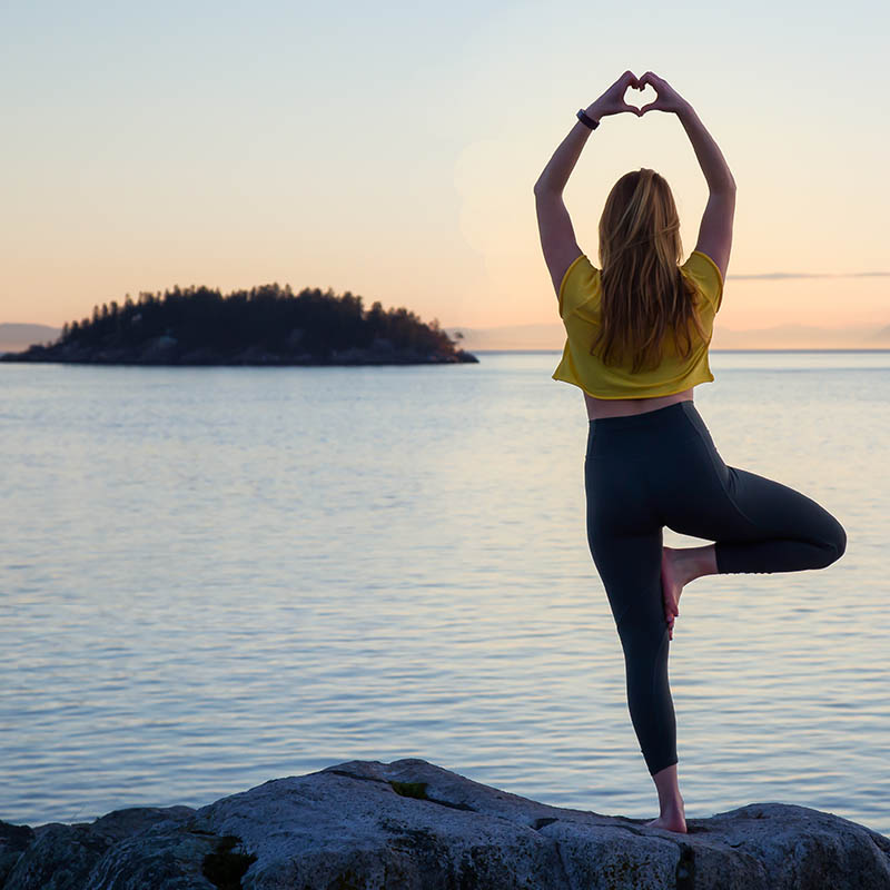 Woman in Yoga pose in Whytecliff Park, Horseshoe Bay, West Vancouver, British Columbia,