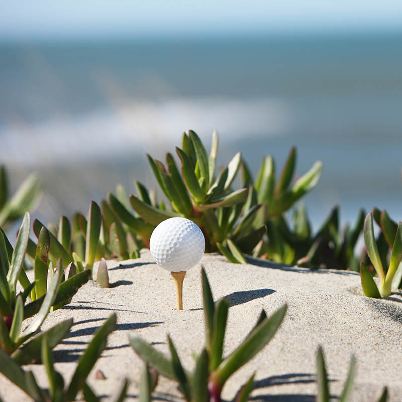 close-up of golf ball at the beach