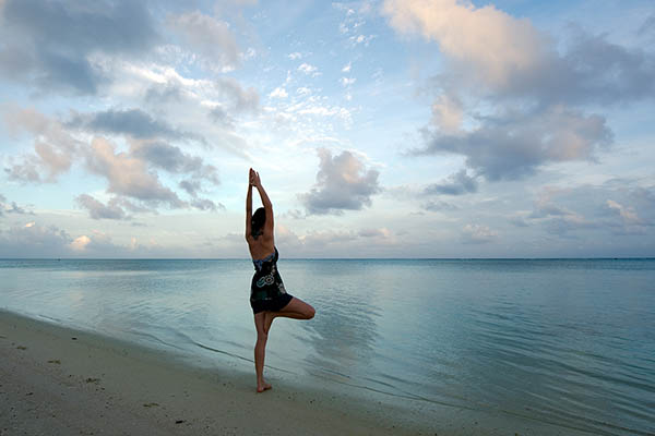 Sunrise yoga on Aitutaki Lagoon Cook Islands