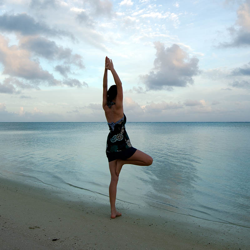 Sunrise yoga on Aitutaki Lagoon Cook Islands