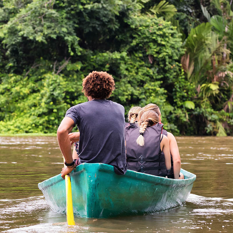 People exploring Tortuguero national park, Costa Rica, by boat