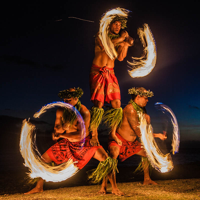 Fire dancers juggling fire in Hawaii