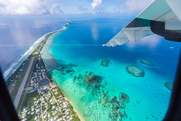 Tuvalu lagoon under wing of an airplane