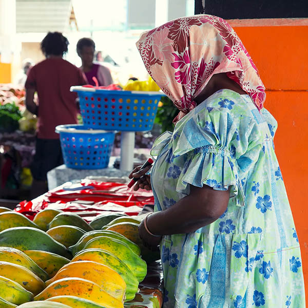 Woman selling fresh Papaya in the market at Port Villa in Vanuatu