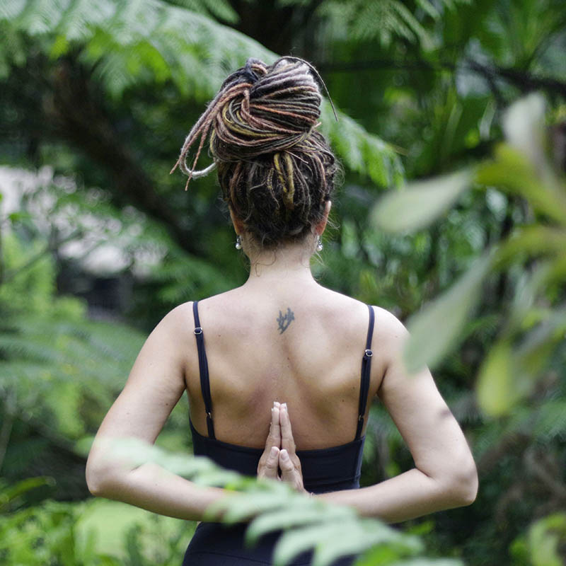 Close-up of a woman's back as she practices a yoga pose