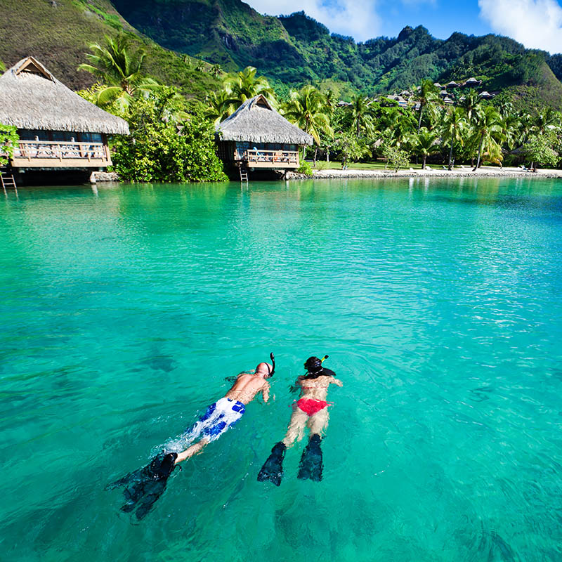 Couple snorkelling in French Polynesia