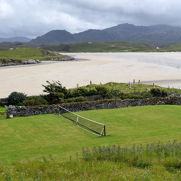 Grass tennis court by the sea in Scotland's Outer Hebrides