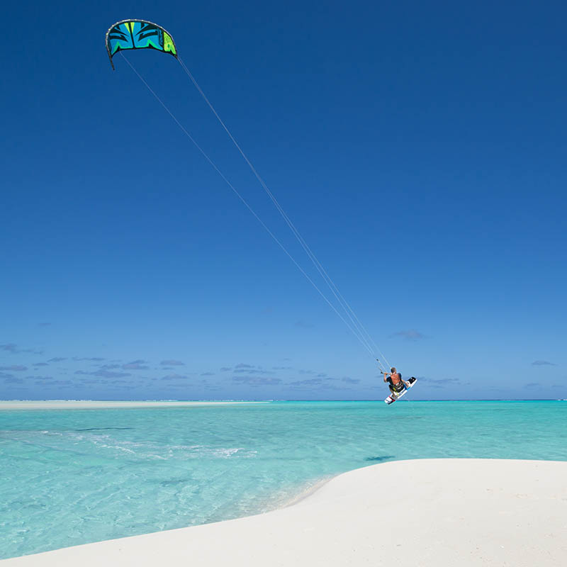 Kitesurfing in a shallow turquoise lagoon