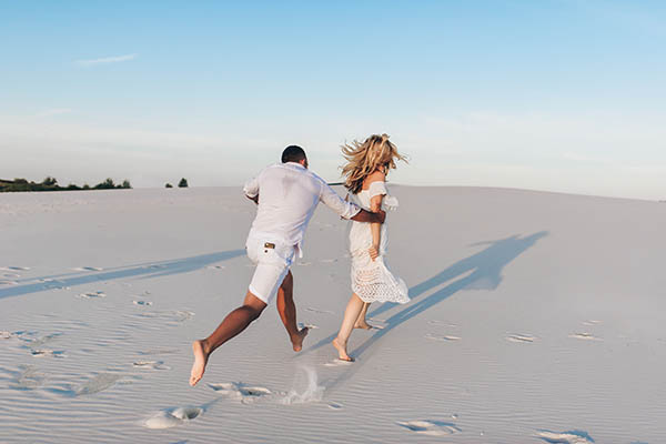 Wedding ceremony flowers on a white sand beach