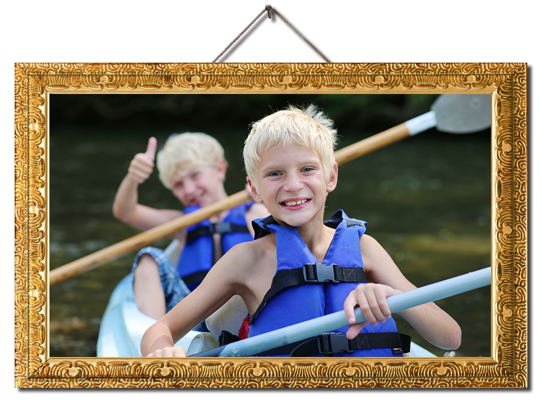 Active happy twin brothers kayaking on the river