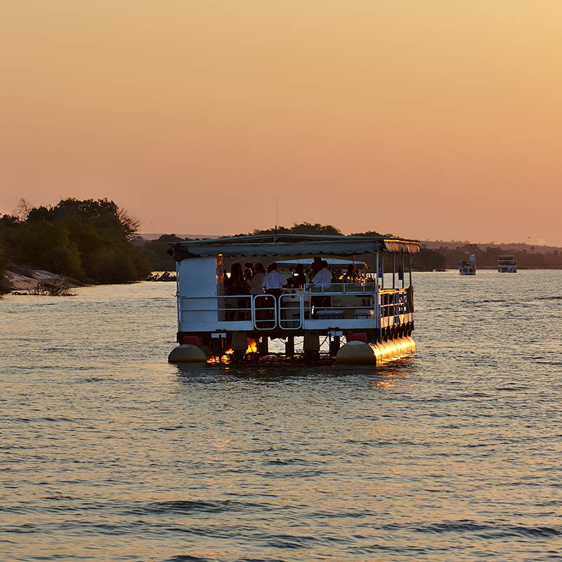 Two safari ships cruising Zambezi river. Victoria Falls, Zimbabwe