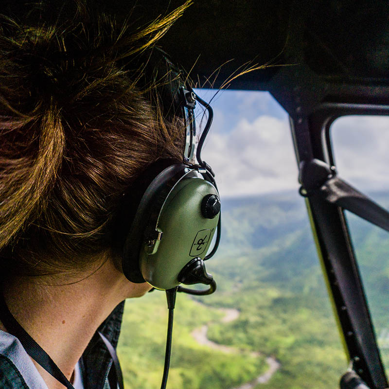 Young woman on a helicopter tour