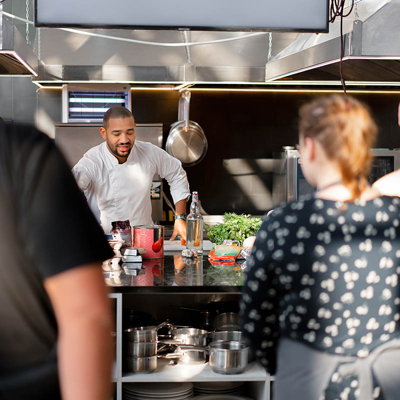 African American chef giving a cooking lesson