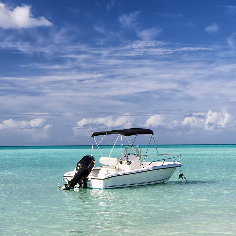 Motor boat on clear turquoise waters