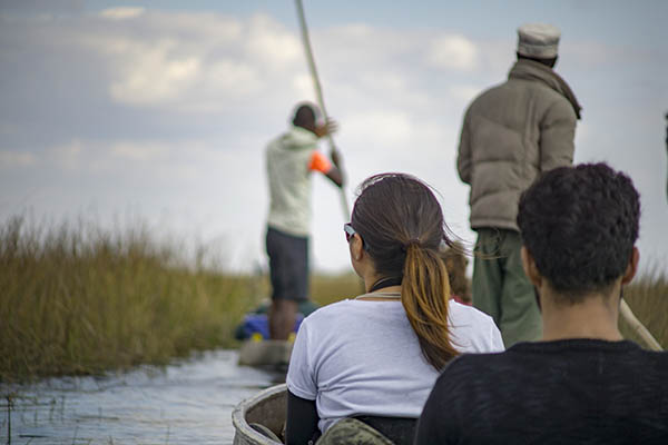 Couple on a canoe trip on the Okavango Delta, Botswana