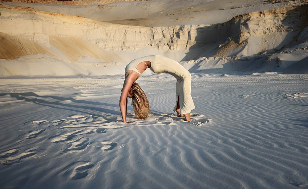 Woman doing yoga n the desert