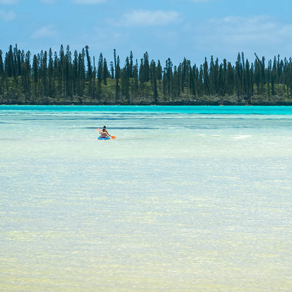 Couple kayaking on the Isle de Pines, New Caledonia