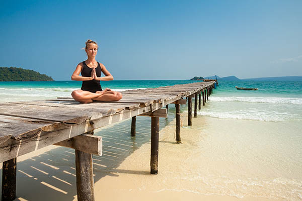 Yoga session on the beach on tropical Koh Rong island, Cambodia