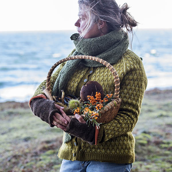 Food forager in traditional clothes by the sea