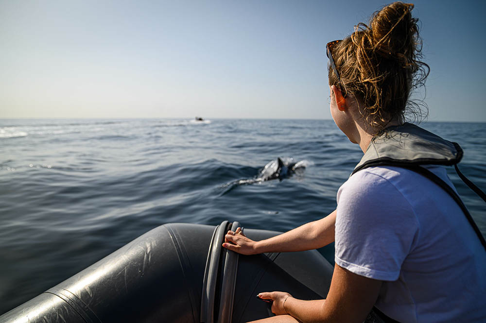 Young woman on boat during dolphin tour