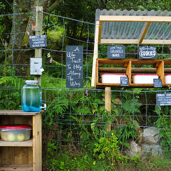 Honesty box with food and water along the West Highland Way in Scotland