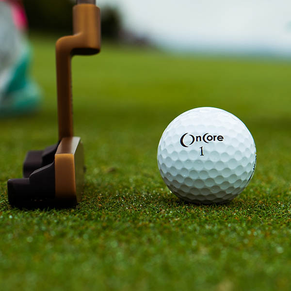 close-up of a golf ball with trainers